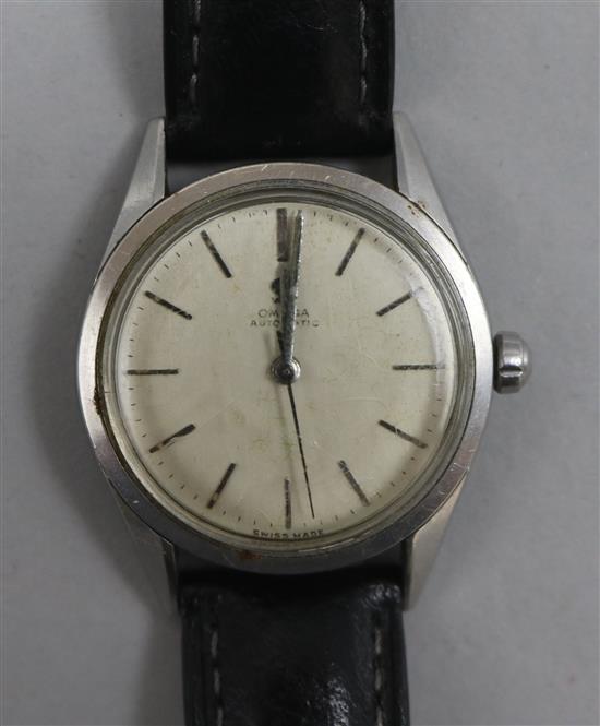 A gentlemans 1950s stainless steel Omega automatic wrist watch.